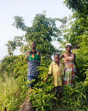 Fatima Vasco Limo and Rita Chiramswuana, with her son Zacarias