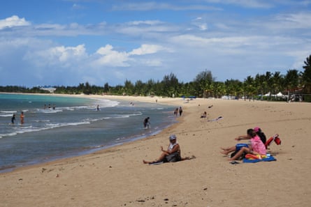 People enjoy Pine Grove beach in Isla Verde, Puerto Rico.