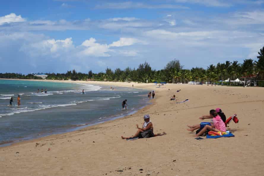 People enjoy Pine Grove Beach in Isla Verde, Puerto Rico.