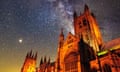 A composite image of Canterbury Cathedral floodlit at dusk and the Milky Way photographed from Mount Olympus in Greece.