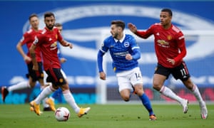Brighton & Hove Albion’s Adam Lallana in action with Manchester United’s Mason Greenwood and Bruno Fernandes