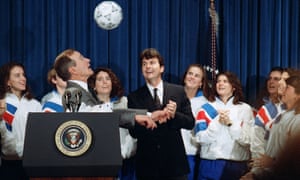 President George Bush attempts a header while meeting Anson Dorrance and his 1991 Women’s World Cup champions.