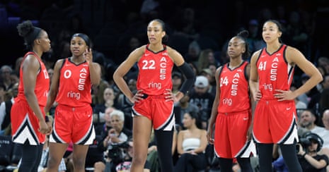 Chelsea Gray, Jackie Young, A’ja Wilson, Jewell Loyd and Kiah Stokes, left to right, talk on the court during a stop in play in a June game against Washington at Michelob Ultra Arena.