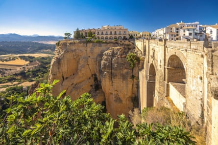 A whitewashed village high up on a cliff
