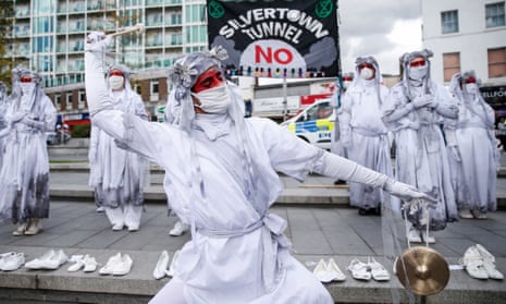 The Banshees perform in Woolwich as part of a protest against the Silvertown tunnel on 31 August 2020. The 26 shoes displayed represent the 26 people who die every day in London because of air pollution.