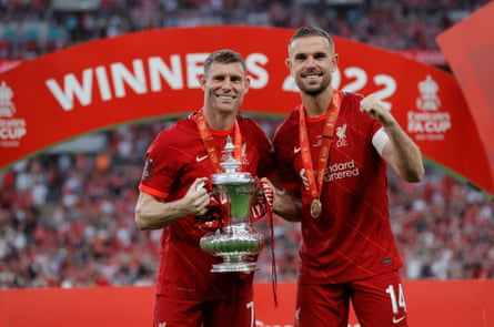 James Milner, with then teammate Jordan Henderson, holds the FA Cup after Liverpool’s win in 2022.