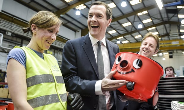 George Osborne shares a joke and admires his handy-work after putting together the face onto a ‘Henry’ vaccum in Chard, Somerset. 