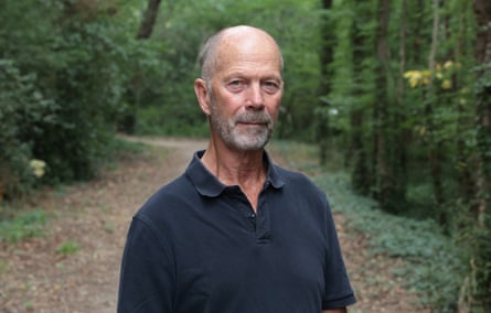 Richard Whitmore-Jones in a blue polo shirt out in a wood