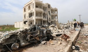 Syrians walk through the rubble following an alleged bombing by Islamic State (IS) group in Marea, northern Aleppo