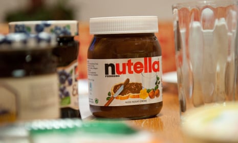 A pot of Nutella on a breakfast table