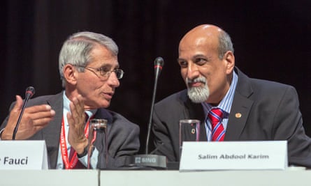 Salim Abdool Karim speaks to Anthony Fauci during the second day of the 21st International Aids conference in Durban in July 2016.