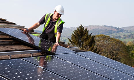Photovoltaic panels are fitted to the roof of a house in Wales