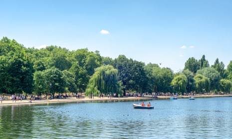The Serpentine Lake in Hyde Park, London, on a sunny day.
