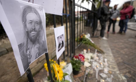 An image of Taylor Hawkins on a makeshift memorial outside the hotel where he was found dead in Bogotá, Colombia