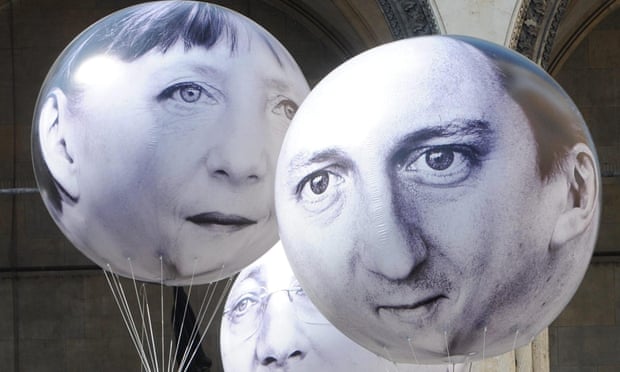 The German chancellor, Angela Merkel, left, and David Cameron depicted during a protest against the G7 summit in Munich. 