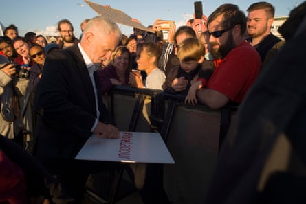 Corbyn signs a placard at a beach rally in Morecambe, 18 August.