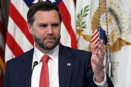 The US vice-president JD Vance speaks at an event in front of an American flag
