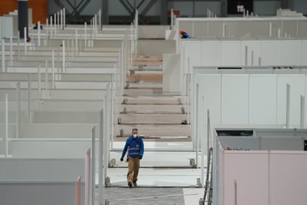 Workers install a field hospital for coronavirus patients in Madrid, Spain, on 21 March, in a handout photo.