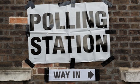 Polling station sign taped to wall in London