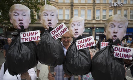 Protesters hold anti-Donald Trump signs during a protest in Queen Street, Cardiff.