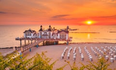 Sellin Pier at sunrise, Baltic Sea, Germany<br>Famous Sellin Seebruecke (Sellin Pier) in beautiful golden morning light at sunrise in summer, Ostseebad Sellin tourist resort, Baltic Sea region, Germany