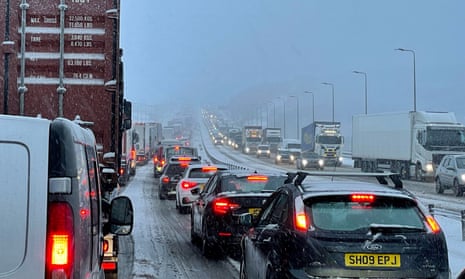 Traffic is seen at a standstill on the M62 motorway near Kirklees, West Yorkshire, due to heavy snowfall.
