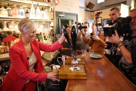 Daisy Cooper pulling a pint of beer after speaking to the press at The Wilton Arms this morning.