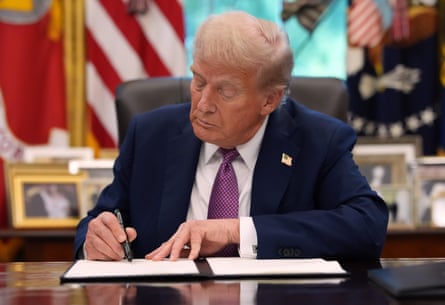 trump signs executive order in the oval office