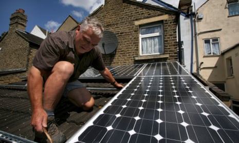 Solar panels being installed on the roof of a house in South East London.