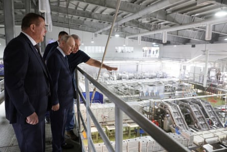 Vladimir Putin visits the Yasny fish processing complex on the southern Kuril island of Iturup last week.