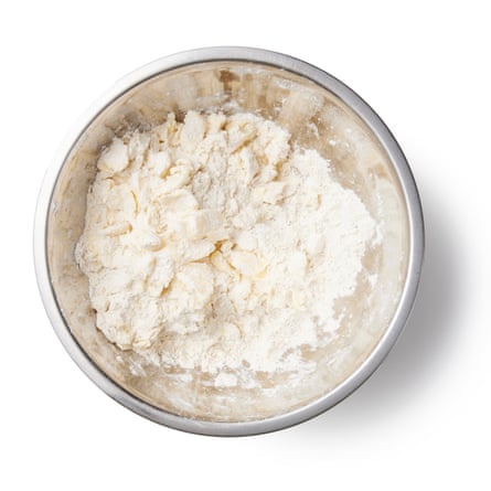 Put the flour, cornmeal, sugar and salt in a large bowl and whisk to combine. Add the diced butter to the flour mix, and toss to coat. Press each piece of butter flat with your fingertips – don’t overwork it