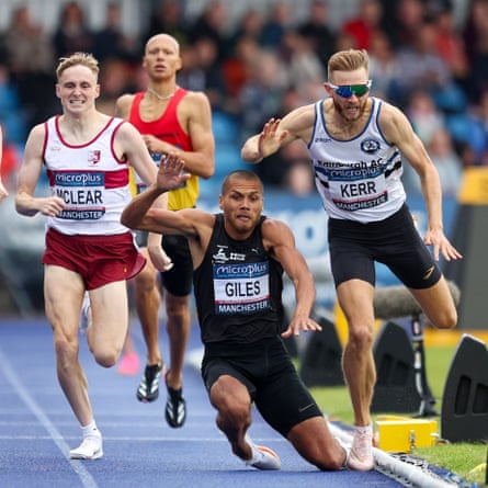 Josh Kerr (right) takes a tumble during the men’s 800m in Manchester after clashing with Elliot Giles.