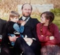 Zoe as a child pictured in a garden with her uncle and her young sister
