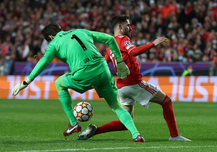 Liverpool’s Alisson in action with Benfica’s Rafa.