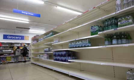 Empty shelves in a London supermarket due to post-Brexit supply chain disruption.
