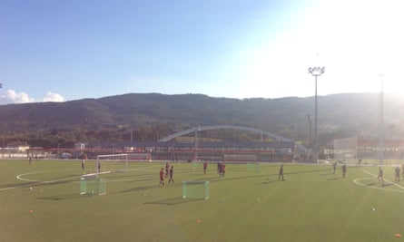 Young players train in front of the Basque hills and famous arch.