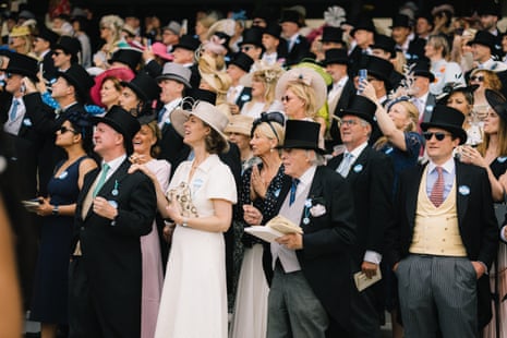 Racegoers watch a race on day two of Royal Ascot.