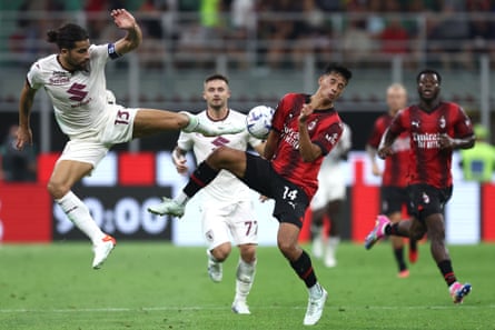 Milan's Tijjani Rendars competes with Torino's Ricardo Rodriguez for the ball