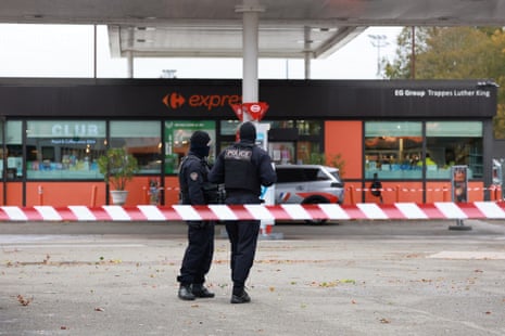 French police work at the scene after a drive-by shooting in Trappes.