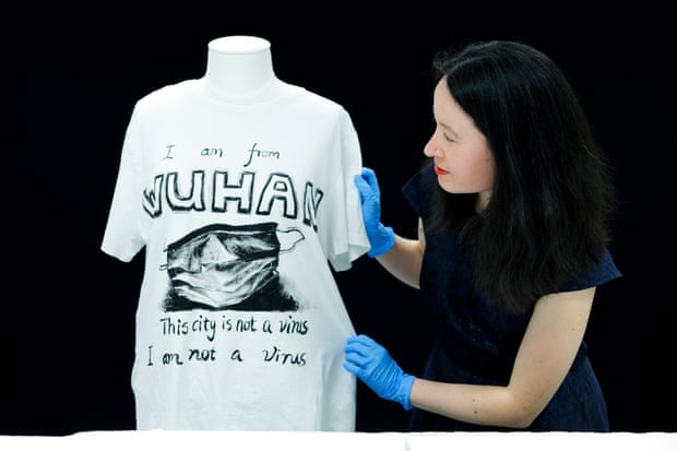 Grace Gassin with a dummy wearing a T-shirt saying 'I am from Wuhan – this city is not a virus, I am not a virus'