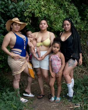 Sophia EvansObserver photographer portrait of The Diaz family, granny Raidiris, sister in black Sandi, Yohanni, daughter of Raidiris with her daughter Ashley and baby son Alan, boyfriend of Sandi is Adonis. Two young girls Wiki and Hannah