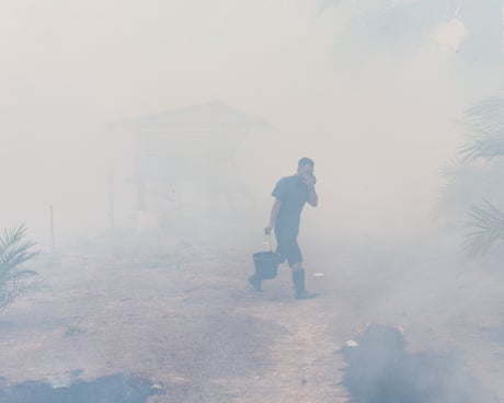Wildfires expand across South Sumatra and neighboring regions in Indonesiaepa13214315 A man carrying a water bucket walks as wildfires get closer to his house in Ogan Ilir, South Sumatra, Indonesia, 05 September 2026. Indonesian authorities have intensified aerial and ground response operations as El Nino-fueled wildfires across Sumatra and Kalimantan generate toxic transboundary haze, affecting air quality and health across the region, including in neighboring Malaysia, Singapore, and the Philippines. EPA/MAST IRHAM