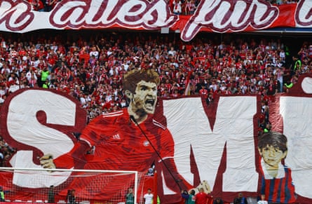 Fans display a banner in support of Bayern Munich’s Thomas Müller to celebrate his 25th anniversary with the club he is leaving at the end of the season.