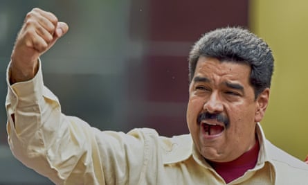 President Nicolas Maduro gestures to the crowd during a rally in Caracas.