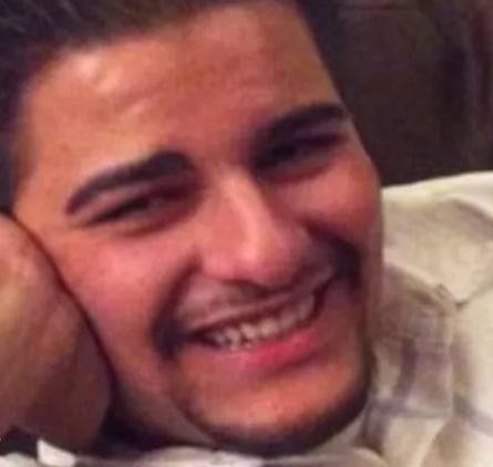 a man smiling at camera