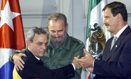 Fidel Castro embraces Spengler as Mexico’s President Vicente Fox applauds.