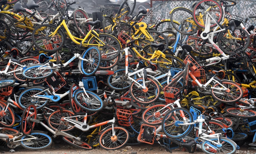 Bicycles of various bike-sharing services piled up in Wuhan, China, in 2018.