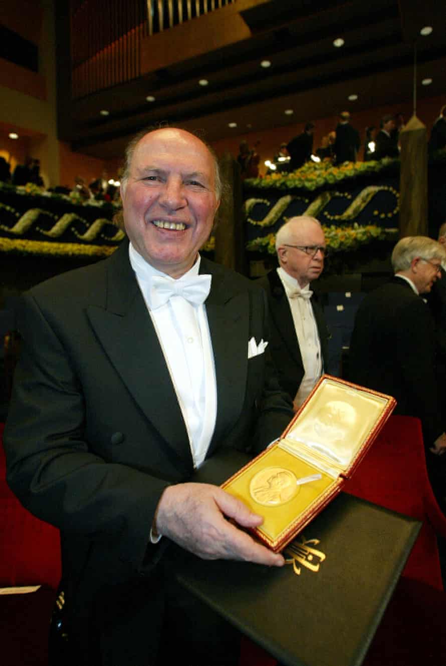 Kertész posing with his Nobel prize during the awards ceremony in Stockholm, 2002.