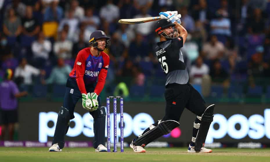 Daryl Mitchell heaves the ball away during his matchwinning 72 not out as Jos Buttler watches on. Photograph: François Nel/Getty Images