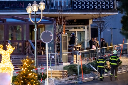 Rescuers are seen at the site of an explosion that ripped through a bar in Crans-Montana on 1 January, 2026
